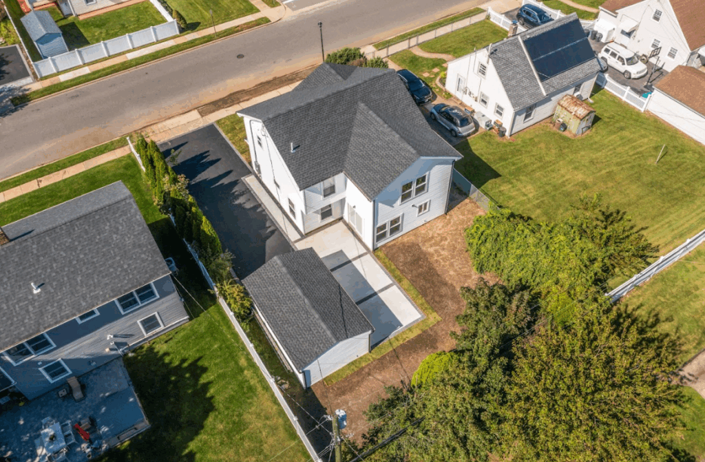 Aerial view of residential roofing completed by Long Beach general contractors