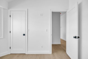 White closet doors installed in modern Long Beach home by local contractors